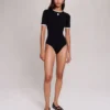 Bodysuit aus offenem Strick Bodysuit aus offenem Strick