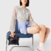Jumpsuit aus Tweed mit Pailletten Jumpsuit aus Tweed mit Pailletten