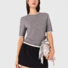 Kurzärmeliger Pullover mit Strasssteinen Kurzärmeliger Pullover mit Strasssteinen