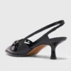 Lederpumps mit Ösenriemen Lederpumps mit Ösenriemen